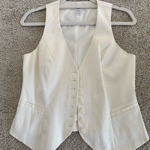 Off white vest, with button closure.